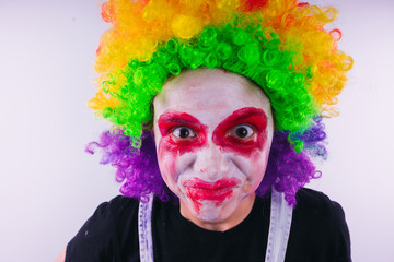 girl in a bright image of a clown. emotional portrait of a student. costumed presentation of...