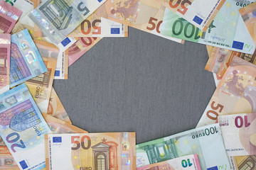 Euro banknotes laid out evenly. Financial background. Different Euro banknotes frame. business, finance, investment, saving and corruption concept - close up of Euro money over concrete background.