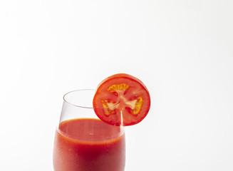 Tasty tomato juice isolated on white background. juice in glass