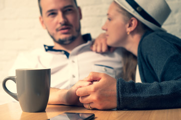 The man holds a female hand in the hand.