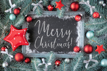 Green and red Christmas background with decorated chalk board, text