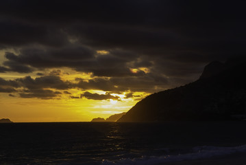 Fototapeta na wymiar Sun setting down over Ipanema beach in Rio de Janeiro Brazil