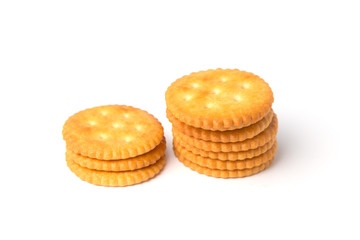 Fototapeta na wymiar Round salted cracker cookies stacked isolated on white background.