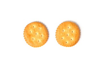 Top view of round salted cracker cookies isolated on white background.