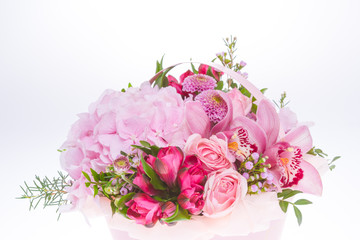 Bright buketny composition from fresh flowers, the white isolated background