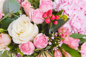 Bright buketny composition from fresh flowers, the white isolated background