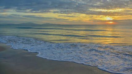 Sea waves and beautiful sunset