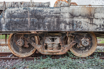 Fototapeta na wymiar Old rusty rail wheel on railroad tracks