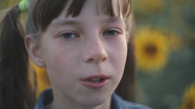 Beautiful teen girl inflating bubble of chewing gum. Moderm fashion girl.