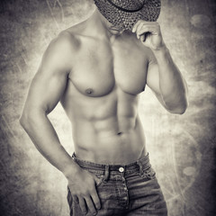 Mann in Jeans mit Cowboyhut 
