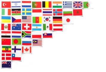 Obraz premium National flags of the different countries of the world located on the left side diagonally.