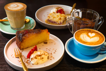 Latte or cappuccino coffee with pie for dessert or breakfast