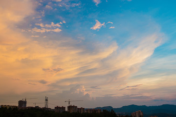 Fototapeta premium Peculiar beautiful sunset cloudscape and hilltop town in summer in Chongqing, China
