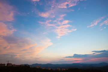 Peculiar beautiful sunset cloudscape and hilltop town in summer in Chongqing, China