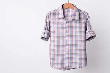 Man's red white cotton plaid shirt on white background.