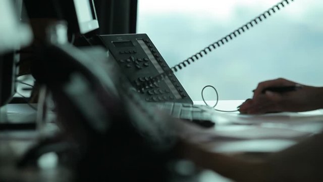 Silhouette of girl working at computer in the background windows