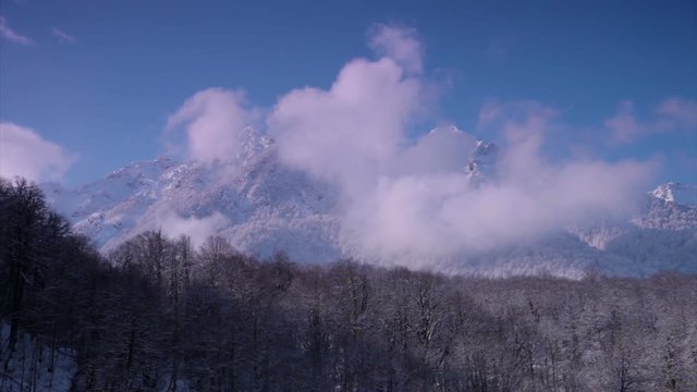 Clouds in the snow-capped peaks timelapse