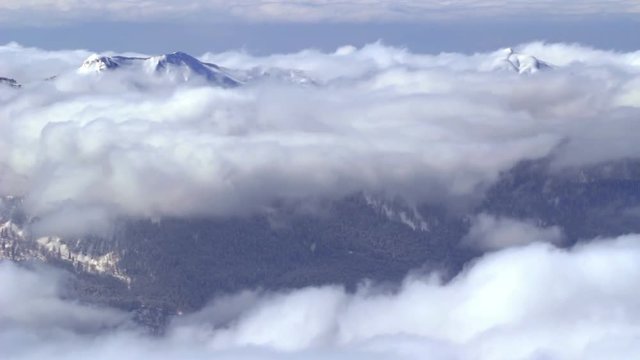 Snow-covered mountains and clouds timelapse