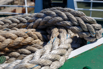Fototapeta na wymiar twisted ship's rope lying on the deck