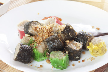 Many Dim sum on a white plate.