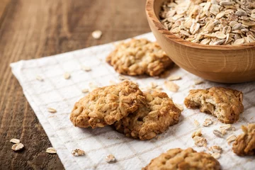 Foto op Plexiglas Homemade oatmeal cookies and oat flakes © ffphoto