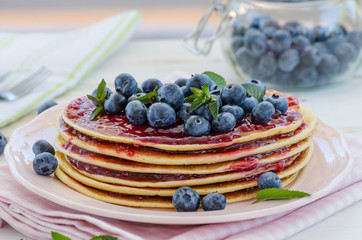 Vintage pancakes outside garden with blueberries
