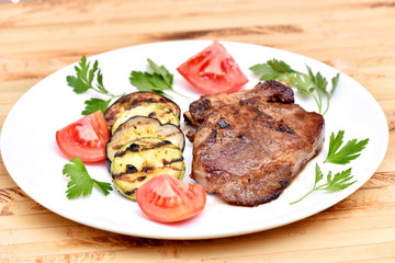 Meat cooked on a grill. Fried beef steak. Healthy food. Restaurant main course.