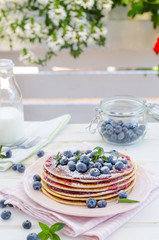 Vintage pancakes outside garden with blueberries