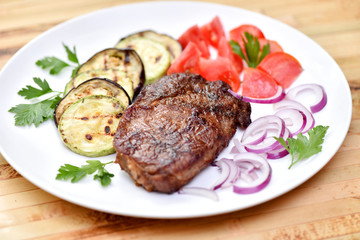 Meat cooked on a grill. Fried beef steak. Healthy food. Restaurant main course.