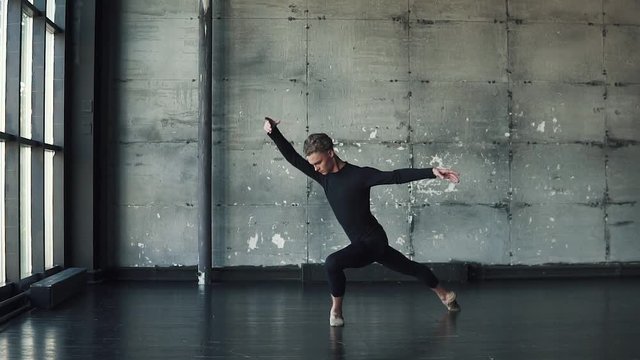 portrait of a male ballet dancer, who gracefully and gracefully dances. slow motion