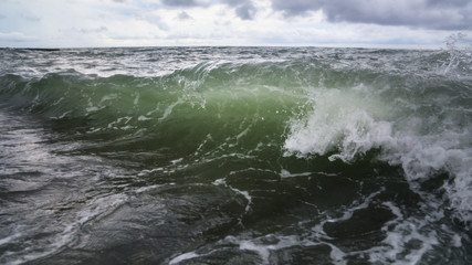 Storm waves on the seashore as a background