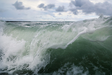 Fototapeta na wymiar Storm waves on the seashore as a background