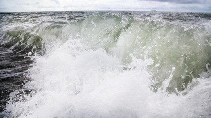 Storm waves on the seashore as a background