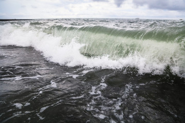 Storm waves on the seashore as a background