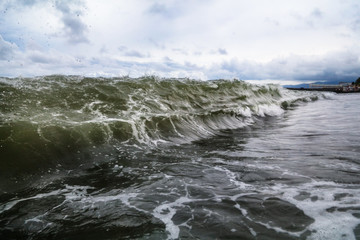 Storm waves on the seashore as a background