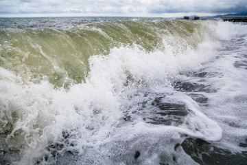 Storm waves on the seashore as a background