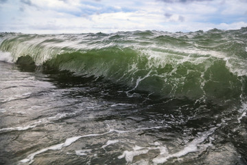 Storm waves on the seashore as a background
