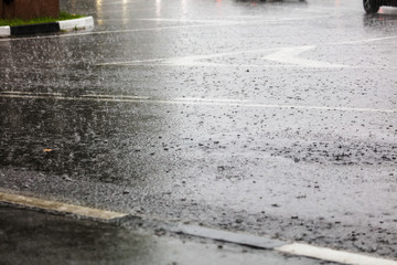 Rain on the asphalt road as background