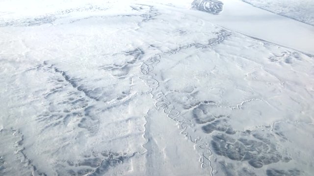 Aerial footage of arctic white frozen landscape