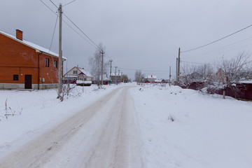 Road dirt in the snow in winter