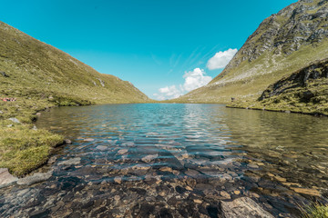The glacie lake Schwarzkarlsee in the Austrian Alps at Nationalpark Hohe Tauern at 2119 meter in Pinzgau
