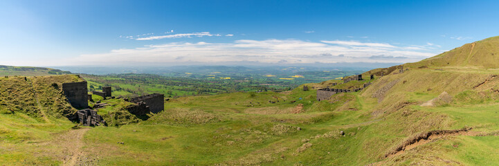 Fototapeta na wymiar View over the Shropshire landscape from Titterstone Clee near Cleeton, England, UK - with ruins of old Quarry buildings