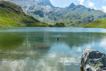 The glacie lake Schwarzkarlsee in the Austrian Alps at Nationalpark Hohe Tauern at 2119 meter in...