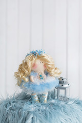 Textile doll with beautiful tiara on curly blond hair.  Handmade