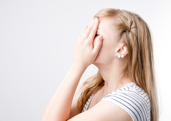 Young beautiful woman with long light hair in bad mood, crying, feels bad and in depression