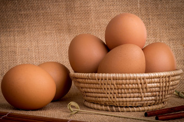 Set Eggs in a basket on  gunny (sackcloth)  background