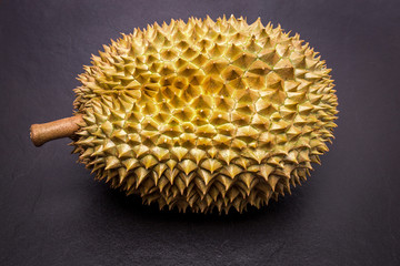 Durian on black stone floor