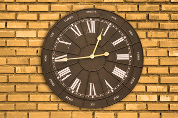 Fototapeta na wymiar Vintage Wall clock on the Square brick wall background