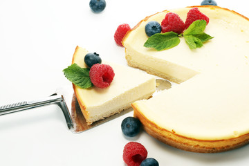 Homemade cheesecake with fresh raspberries and mint for dessert - healthy organic summer dessert pie cheesecake. Vanilla Cheese Cake