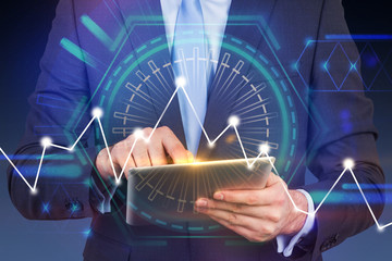 Businessman with tablet, graph and hud